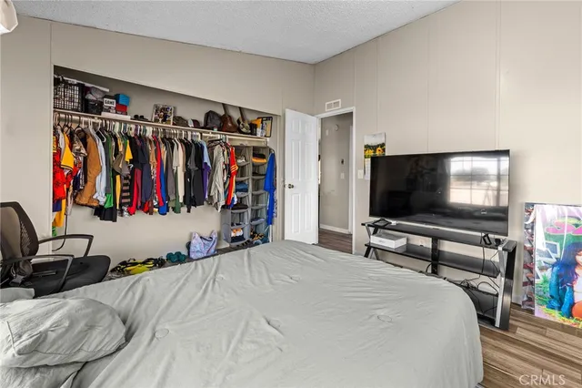 an aerial view of a house with yard swimming pool and lake view