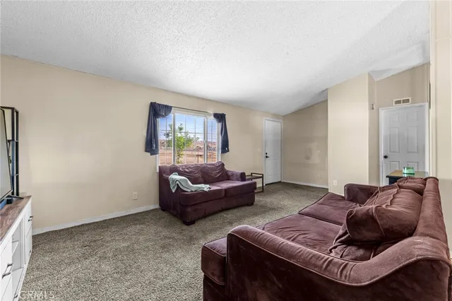 an aerial view of a house with a yard basket ball court and outdoor seating