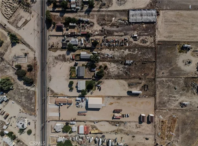 a spacious bathroom with a granite countertop sink and a mirror