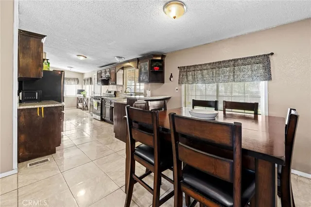 a kitchen with a sink cabinets and a window