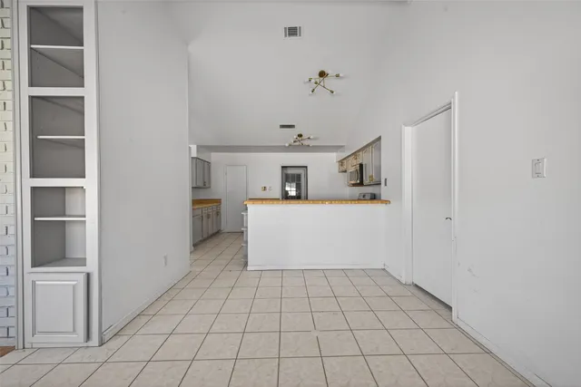 a view of a kitchen with furniture and cabinets