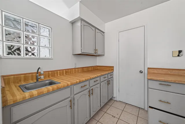 a kitchen with stainless steel appliances granite countertop a stove and a sink