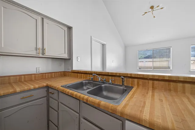 a kitchen with a sink and cabinets