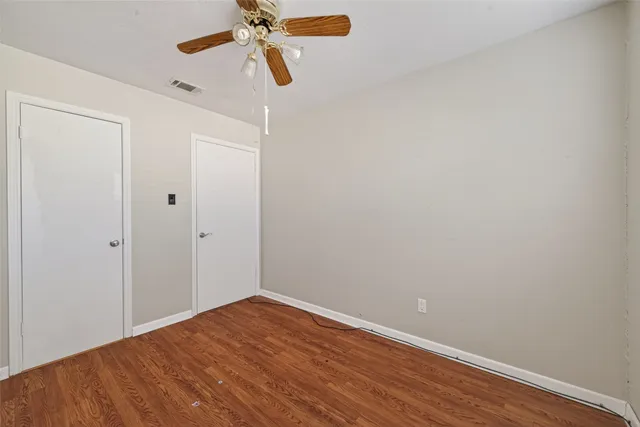 a bathroom with a toilet and a bathtub