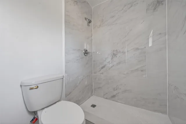 a bathroom with a sink a mirror and shower