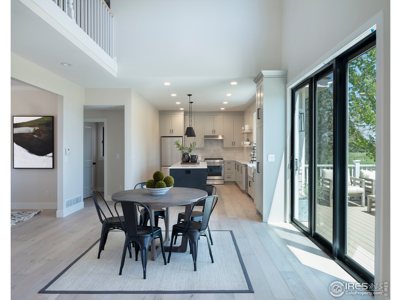 5685 Euclid Place Boulder, CO 80303 - Photo 13 of 38 a view of a dining room with furniture window and wooden floor