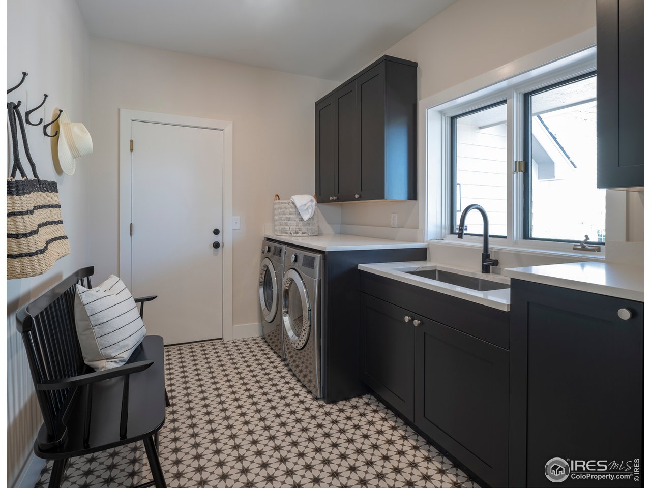 5685 Euclid Place Boulder, CO 80303 - Photo 16 of 38 a kitchen with a sink cabinets and window