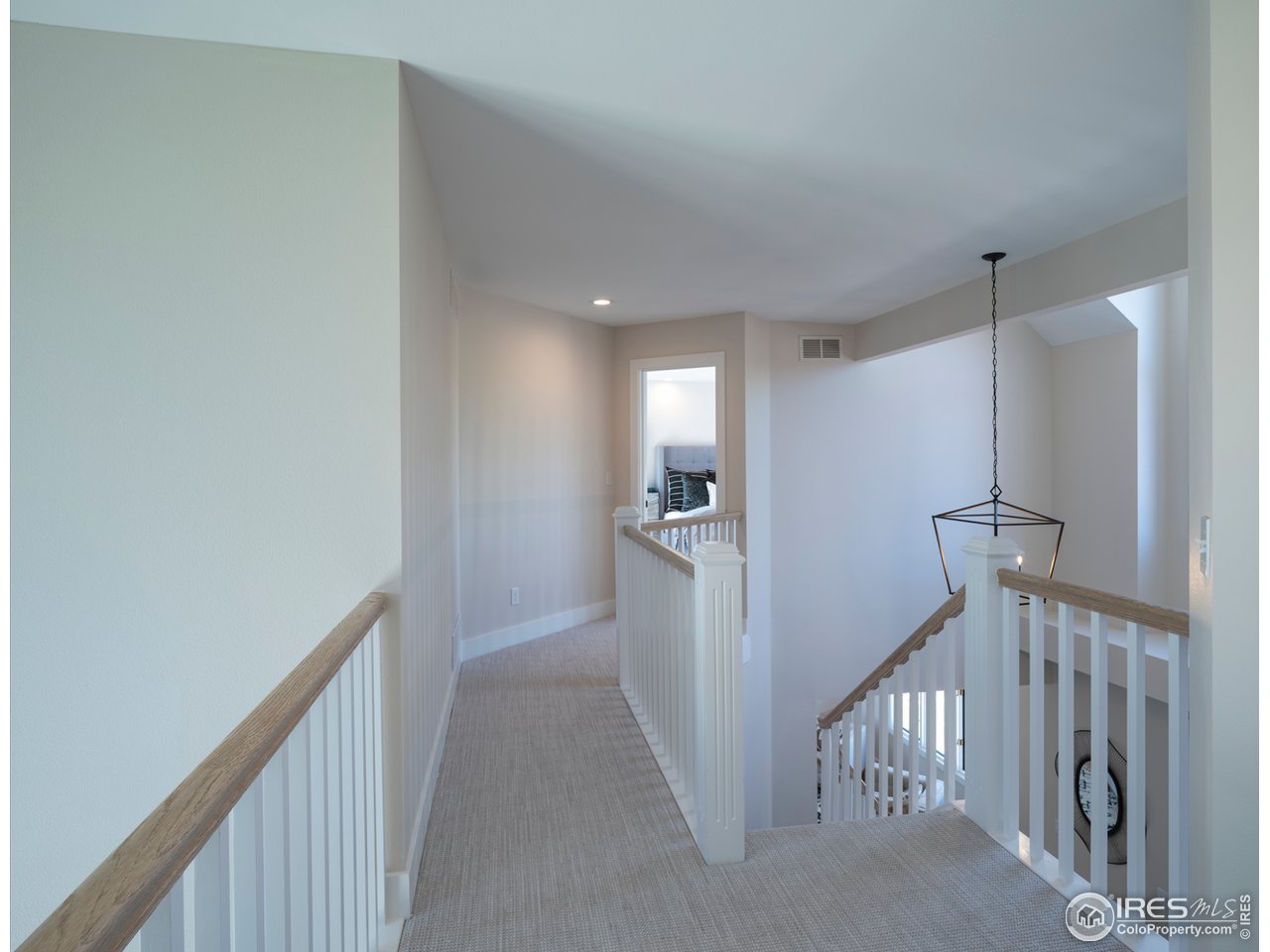 5685 Euclid Place Boulder, CO 80303 - Photo 23 of 38 a view of hallway with wooden floor