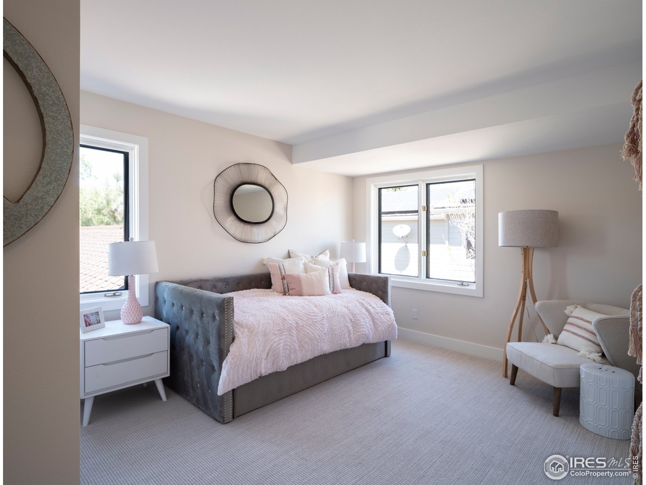 5685 Euclid Place Boulder, CO 80303 - Photo 25 of 38 a bedroom with a bed couch and window