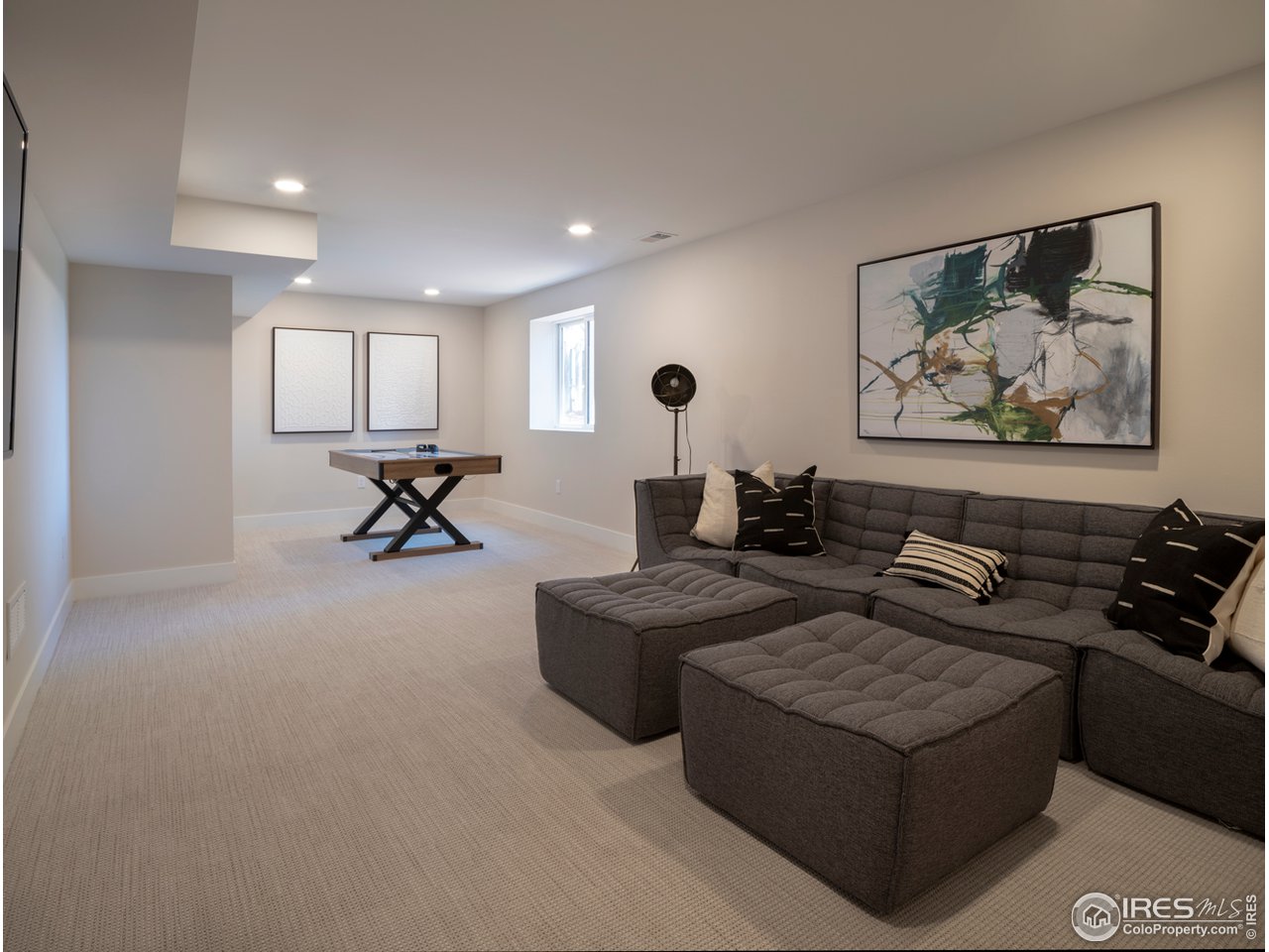 5685 Euclid Place Boulder, CO 80303 - Photo 28 of 38 a living room with furniture and a painting on the wall