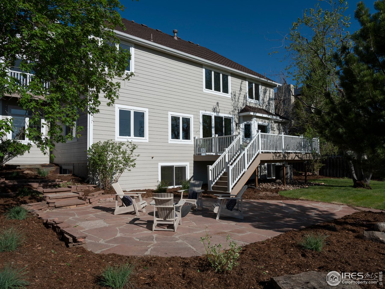 5685 Euclid Place Boulder, CO 80303 - Photo 30 of 38 a view of a house with backyard sitting area and garden