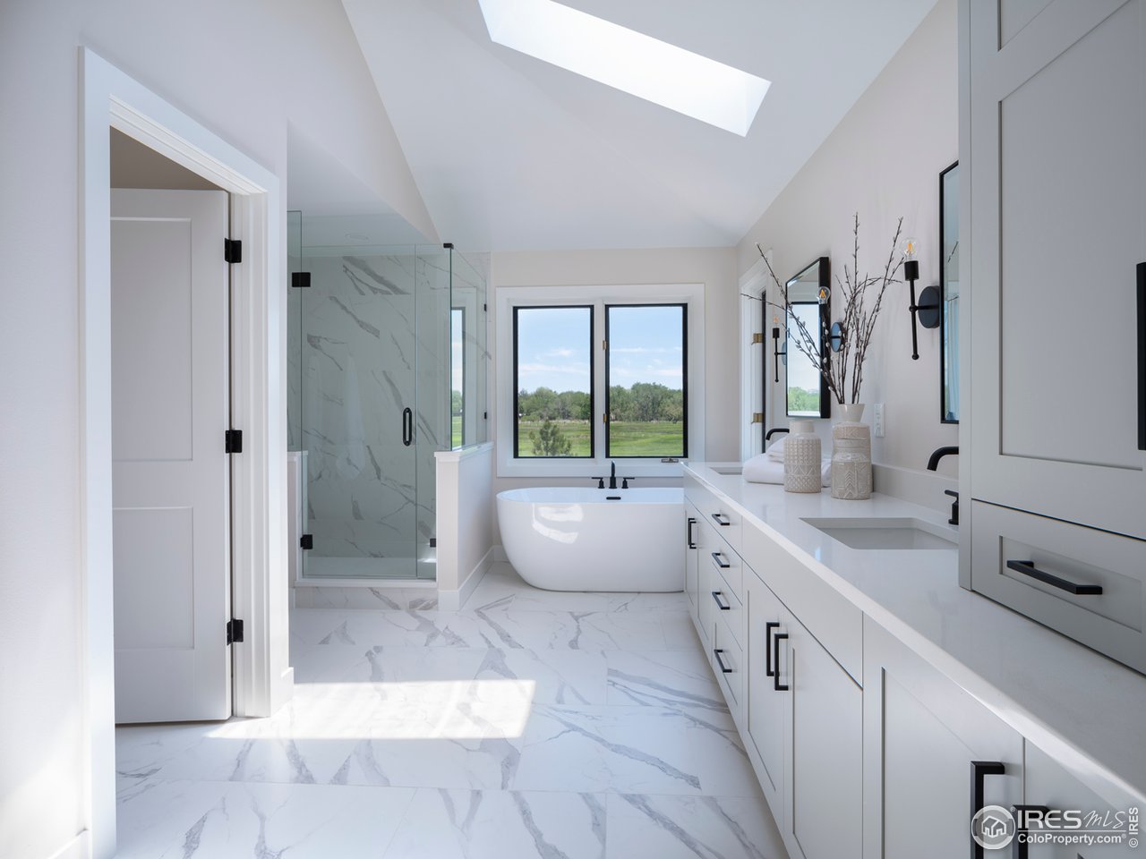 5685 Euclid Place Boulder, CO 80303 - Photo 3 of 38 a bathroom with a double vanity sink toilet and shower