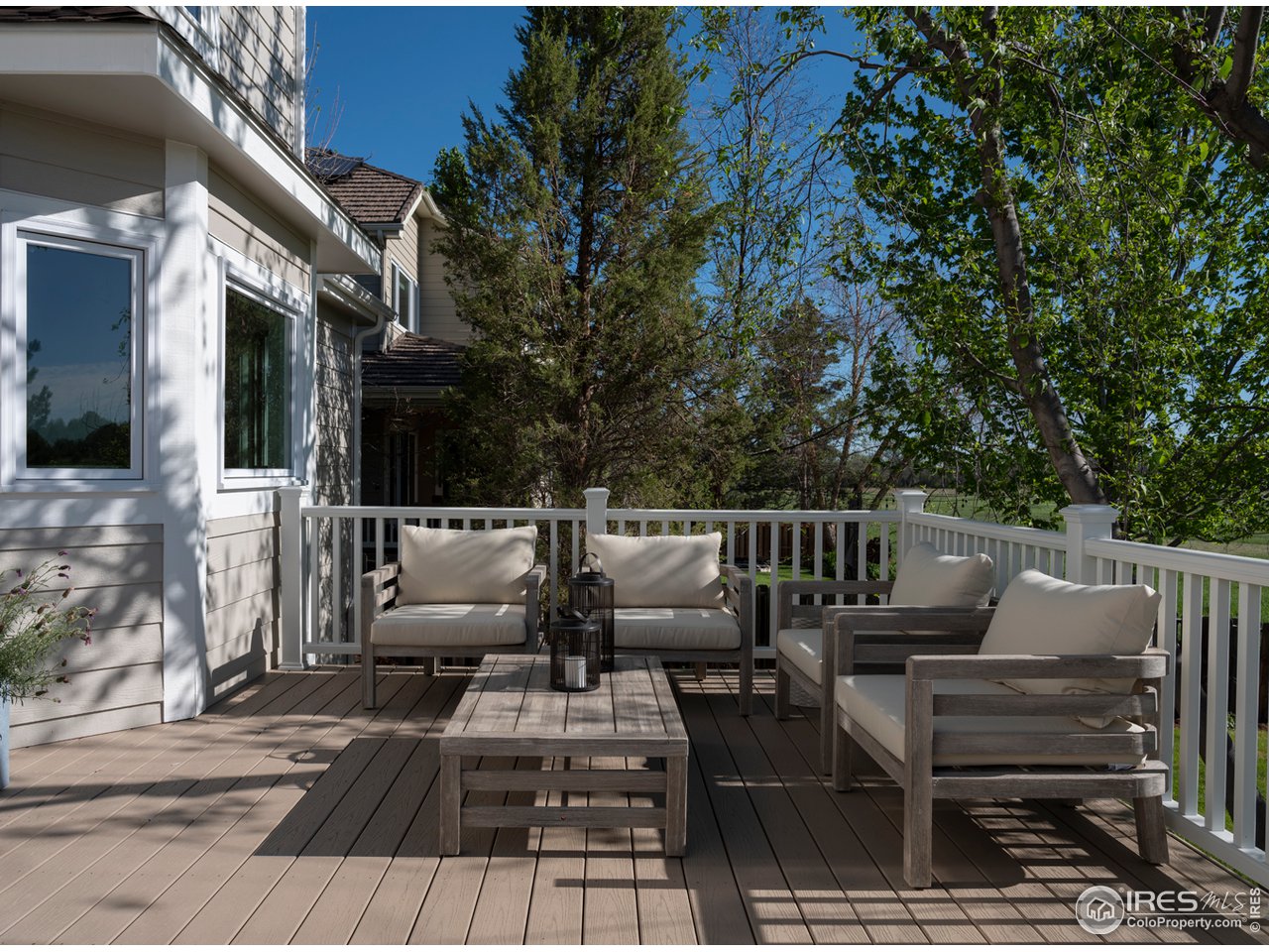 5685 Euclid Place Boulder, CO 80303 - Photo 32 of 38 a view of backyard with seating area and trees