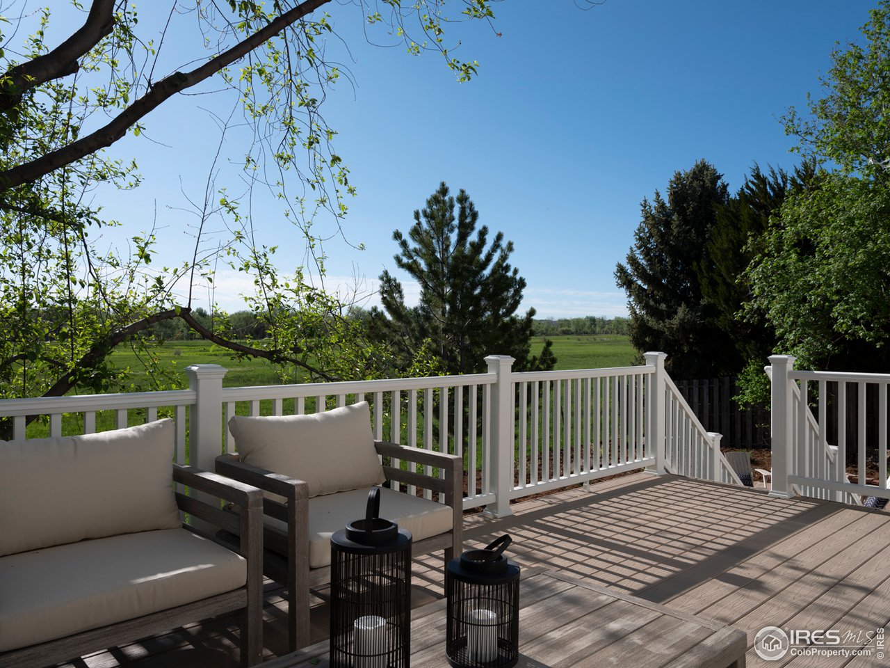 5685 Euclid Place Boulder, CO 80303 - Photo 33 of 38 a balcony with wooden floor table and chairs
