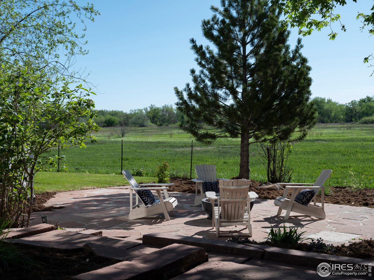 5685 Euclid Place Boulder, CO 80303 - Photo 37 of 38 a view of a patio with table and chairs potted plants and a big yard