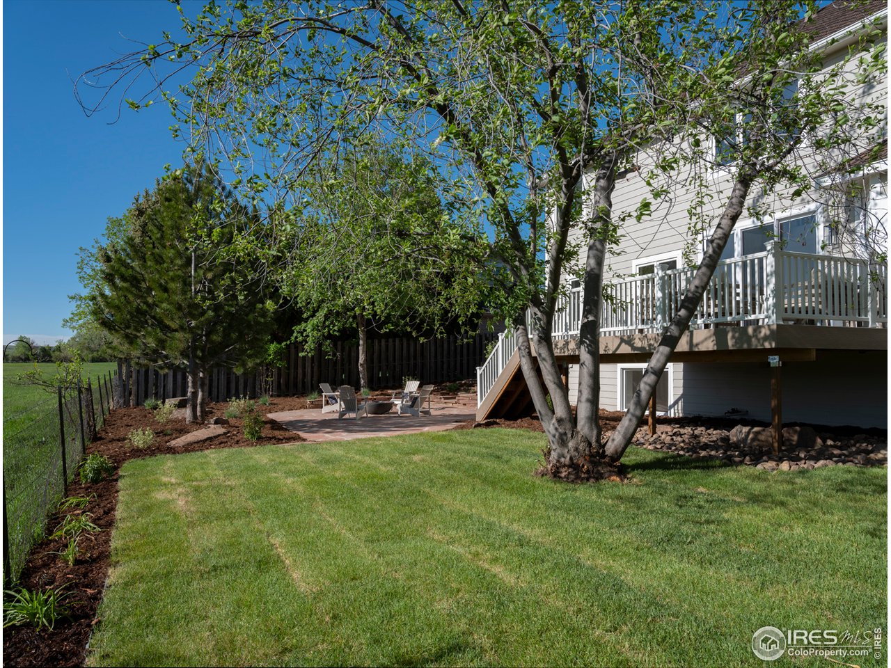 5685 Euclid Place Boulder, CO 80303 - Photo 38 of 38 a view of a backyard with table and chairs