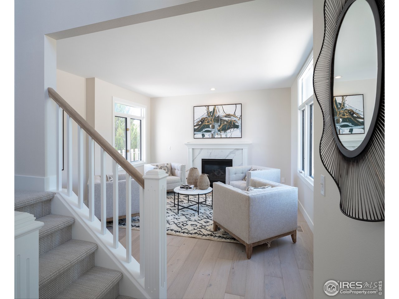 5685 Euclid Place Boulder, CO 80303 - Photo 10 of 38 a living room with furniture a rug and a fireplace