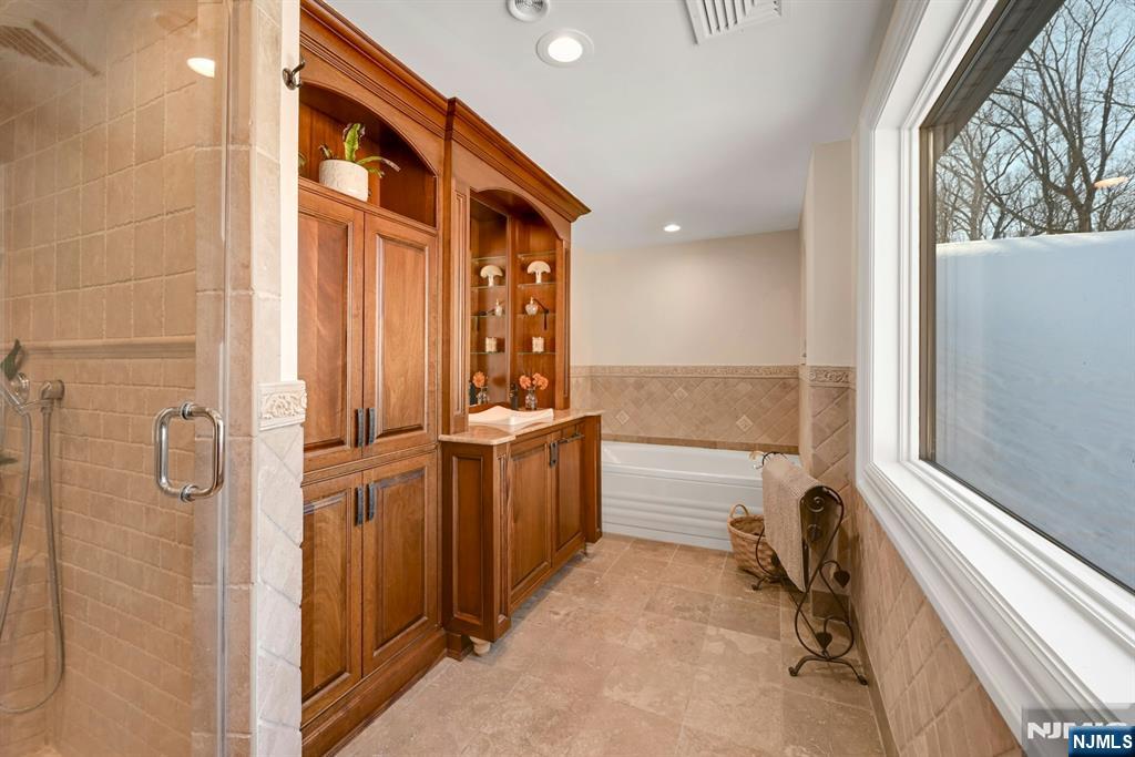 285 Chestnut Ridge Road Woodcliff Lake, NJ 07677 - Photo 41 of 46 a bathroom with a bathtub and a sink
