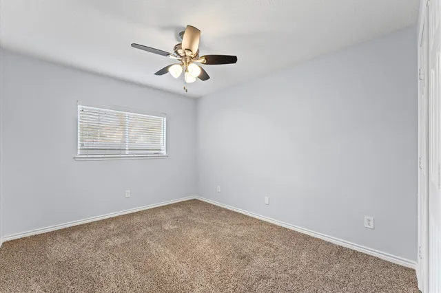 a bathroom with a toilet and a bathtub