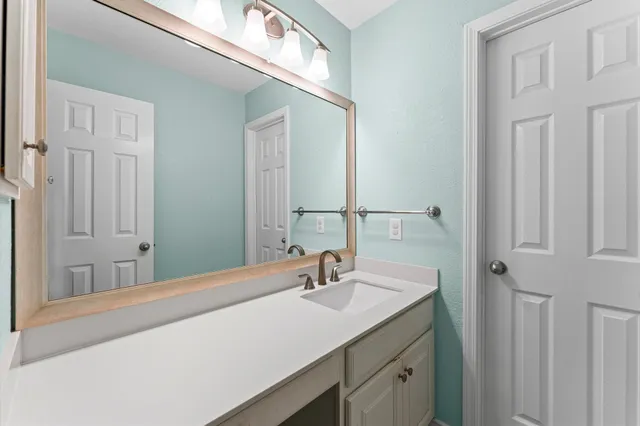 a view of an empty room with a fan