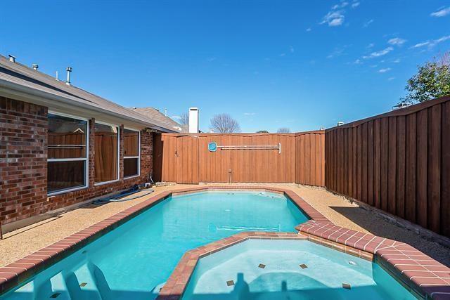 7848 Lancelot Road Frisco, TX 75035 - Photo 27 of 27 a view of a backyard with a small pool