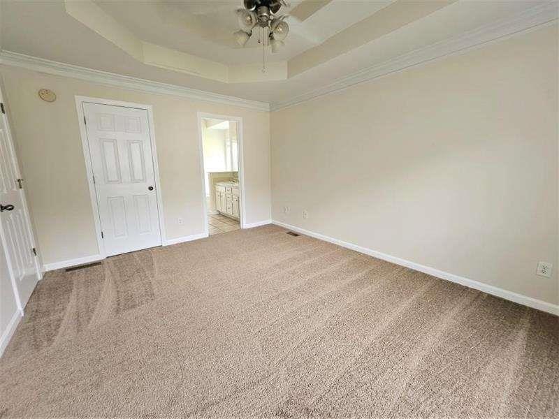 197 Meadow Spring Court Temple, GA 30179 - Photo 15 of 29 an empty room with a ceiling fan and window