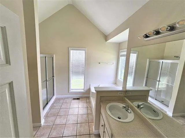a bathroom with a sink mirror vanity and toilet