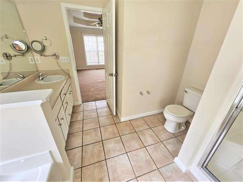 197 Meadow Spring Court Temple, GA 30179 - Photo 20 of 29 a bathroom with a sink and a mirror