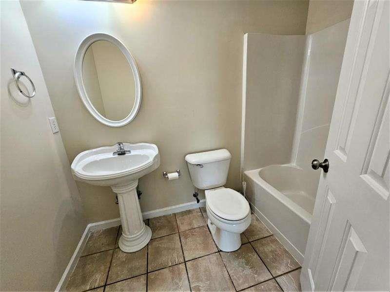 197 Meadow Spring Court Temple, GA 30179 - Photo 26 of 29 a bathroom with a sink toilet and a mirror