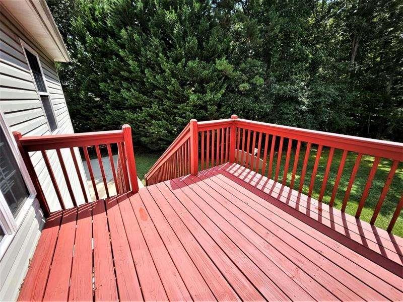 197 Meadow Spring Court Temple, GA 30179 - Photo 29 of 29 a view of balcony with wooden floor and fence