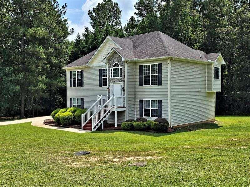 197 Meadow Spring Court Temple, GA 30179 - Photo 3 of 29 a front view of a house with garden