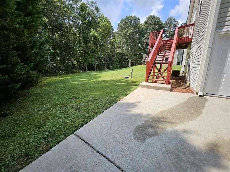 197 Meadow Spring Court Temple, GA 30179 - Photo 5 of 29 a view of outdoor space with deck and backyard