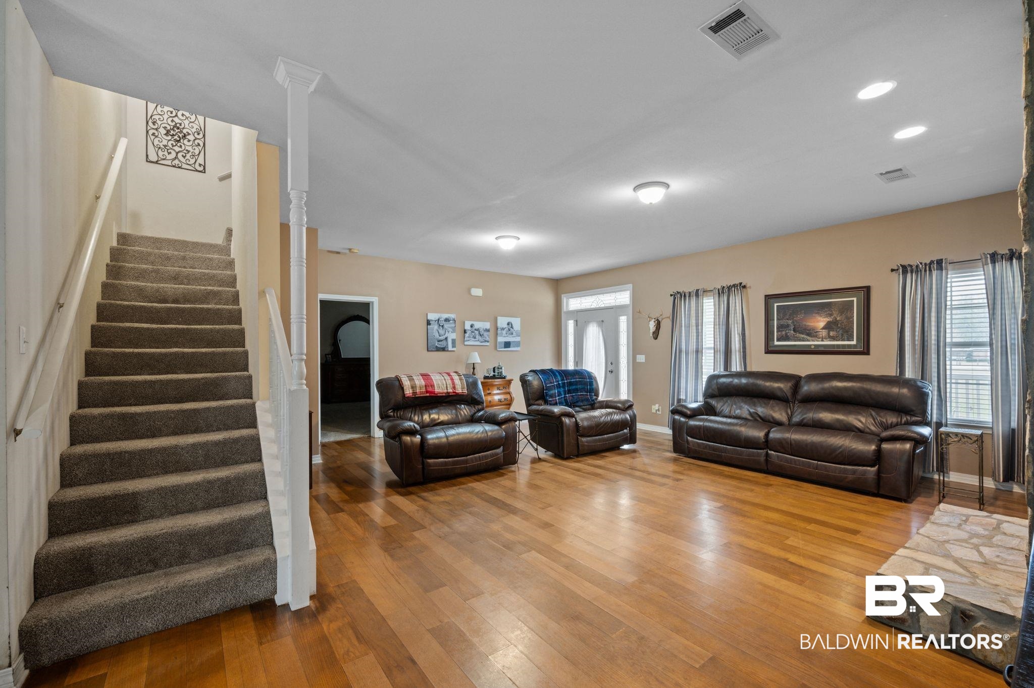 9539 Lakeview Road Bay Minette, AL 36507 - Photo 7 of 45 Living room featuring wood-type flooring and a wealth of natural light