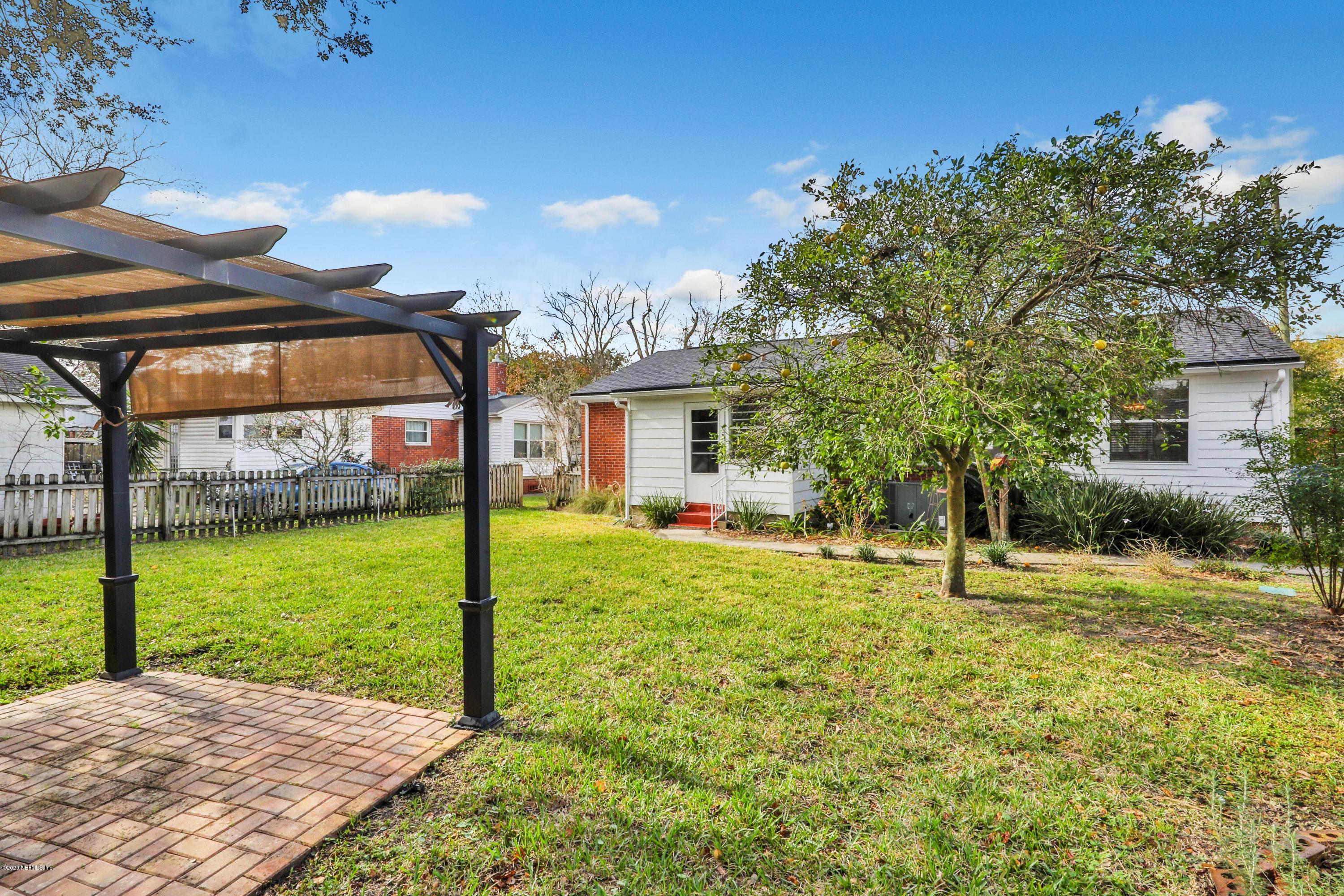 4033 Dover Road Jacksonville, FL 32207 - Photo 23 of 25 a view of a house with backyard and a tree