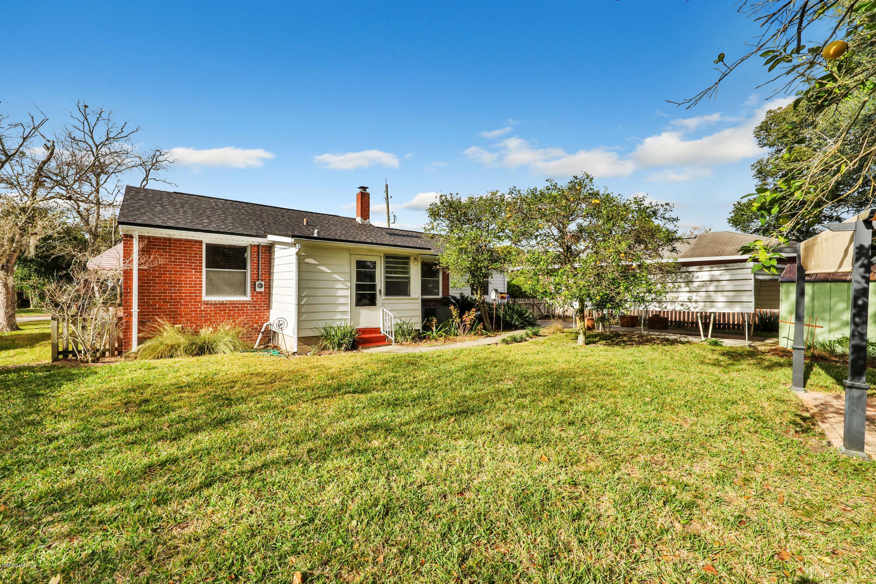 4033 Dover Road Jacksonville, FL 32207 - Photo 25 of 25 a front view of house with yard and trees in the background