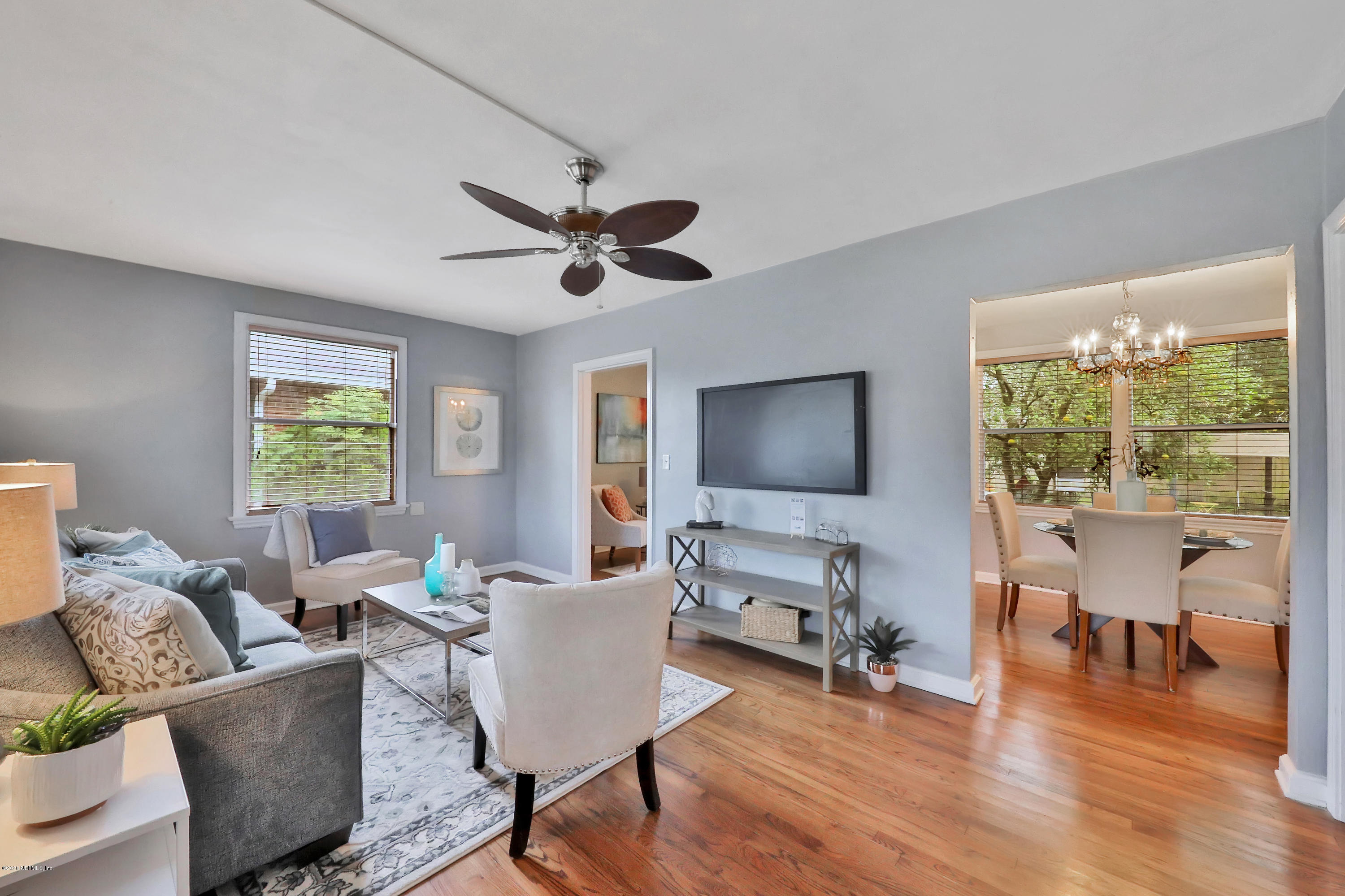 4033 Dover Road Jacksonville, FL 32207 - Photo 6 of 25 a living room with furniture a flat screen tv and wooden floor