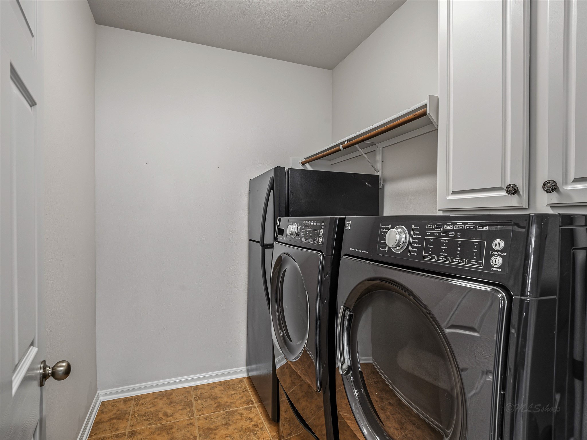 2210 Fox Path Katy, TX 77494 - Photo 24 of 47 This spacious laundry room is designed to make household chores entirely effortless while providing essential bonus storage.
