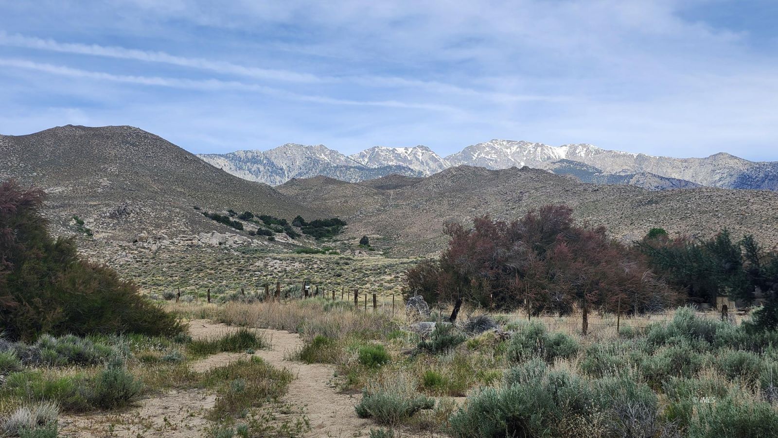 1915 Sage Flats Drive Olancha, CA 93549 - Photo 34 of 34 a view of a dry field with mountains in the background