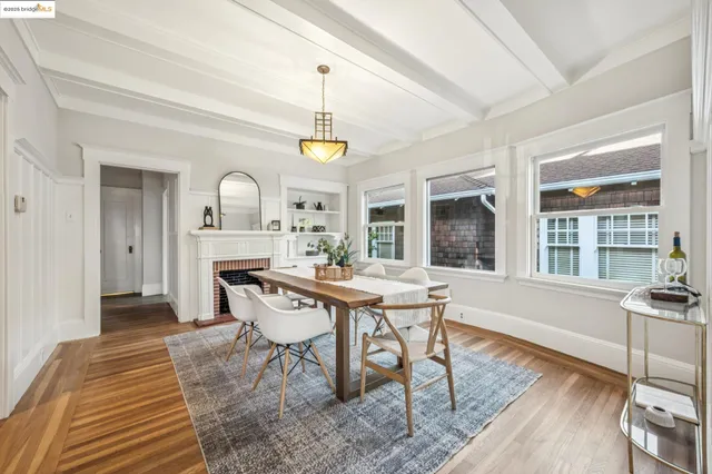 a view of a dining room with furniture and window