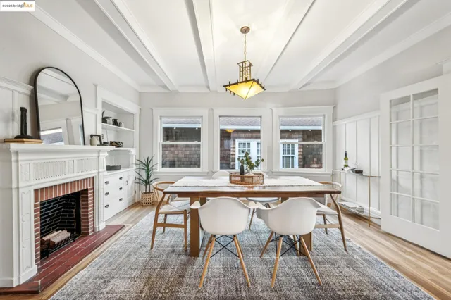a view of a dining room with furniture wooden floor and chandelier