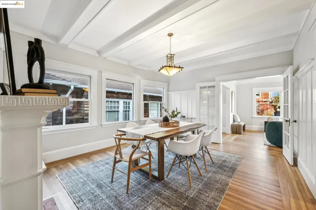 a view of a dining room with furniture and chandelier