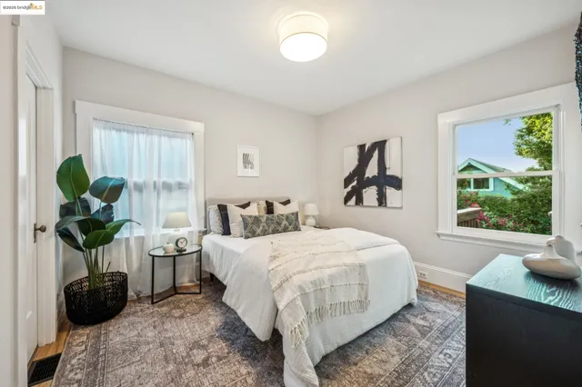 a bed room with a bed and a window