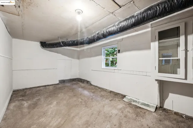 a terrace with outdoor seating and trees