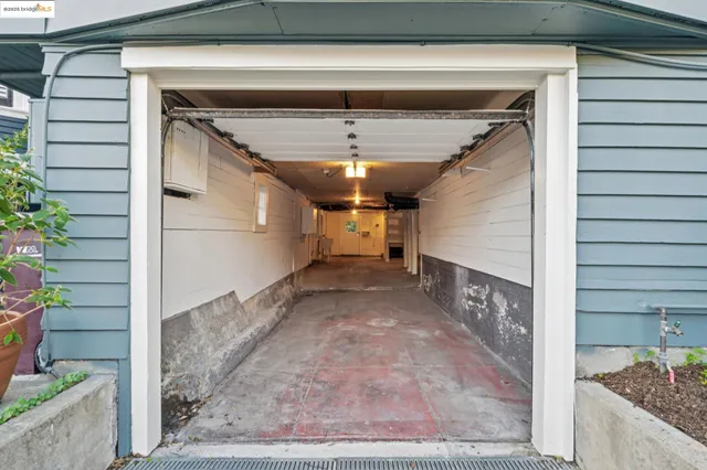 a view of a chairs and table in the backyard