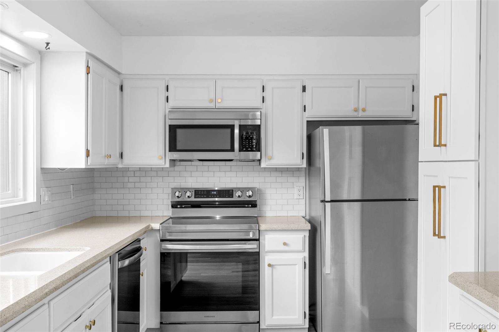34 Benthaven Place Boulder, CO 80305 - Photo 11 of 40 a kitchen with cabinets stainless steel appliances and a sink