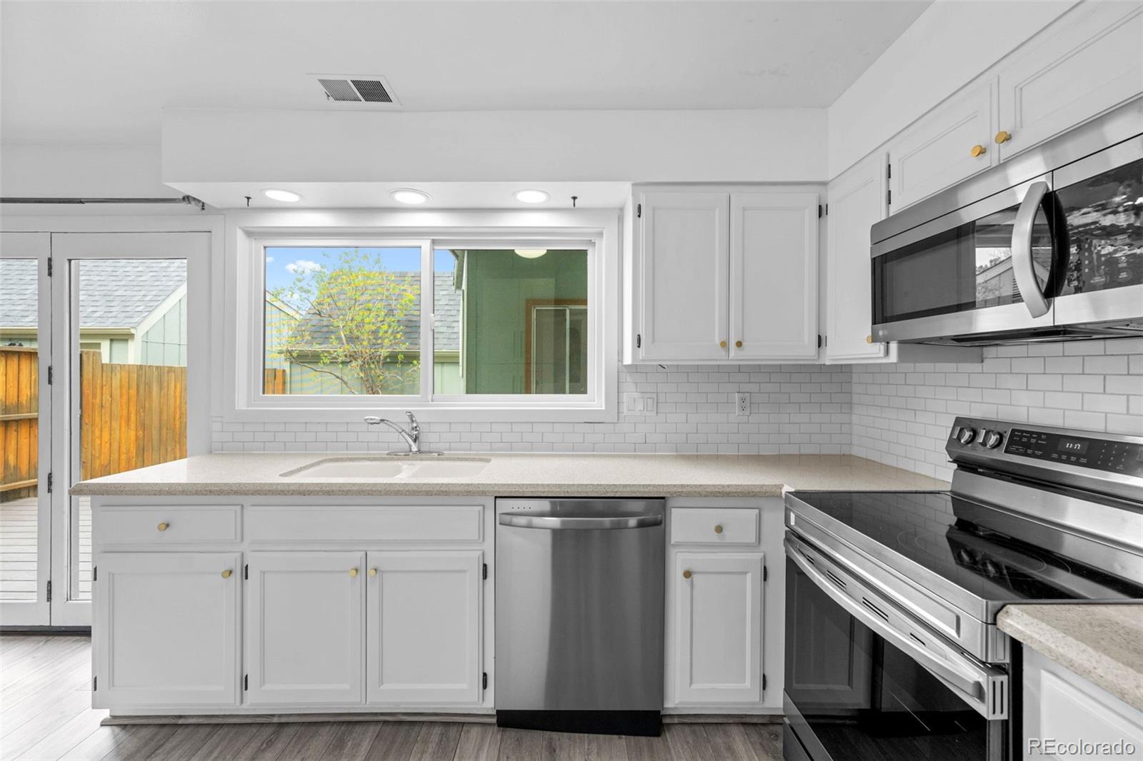 34 Benthaven Place Boulder, CO 80305 - Photo 15 of 40 a kitchen with stainless steel appliances white cabinets and a sink
