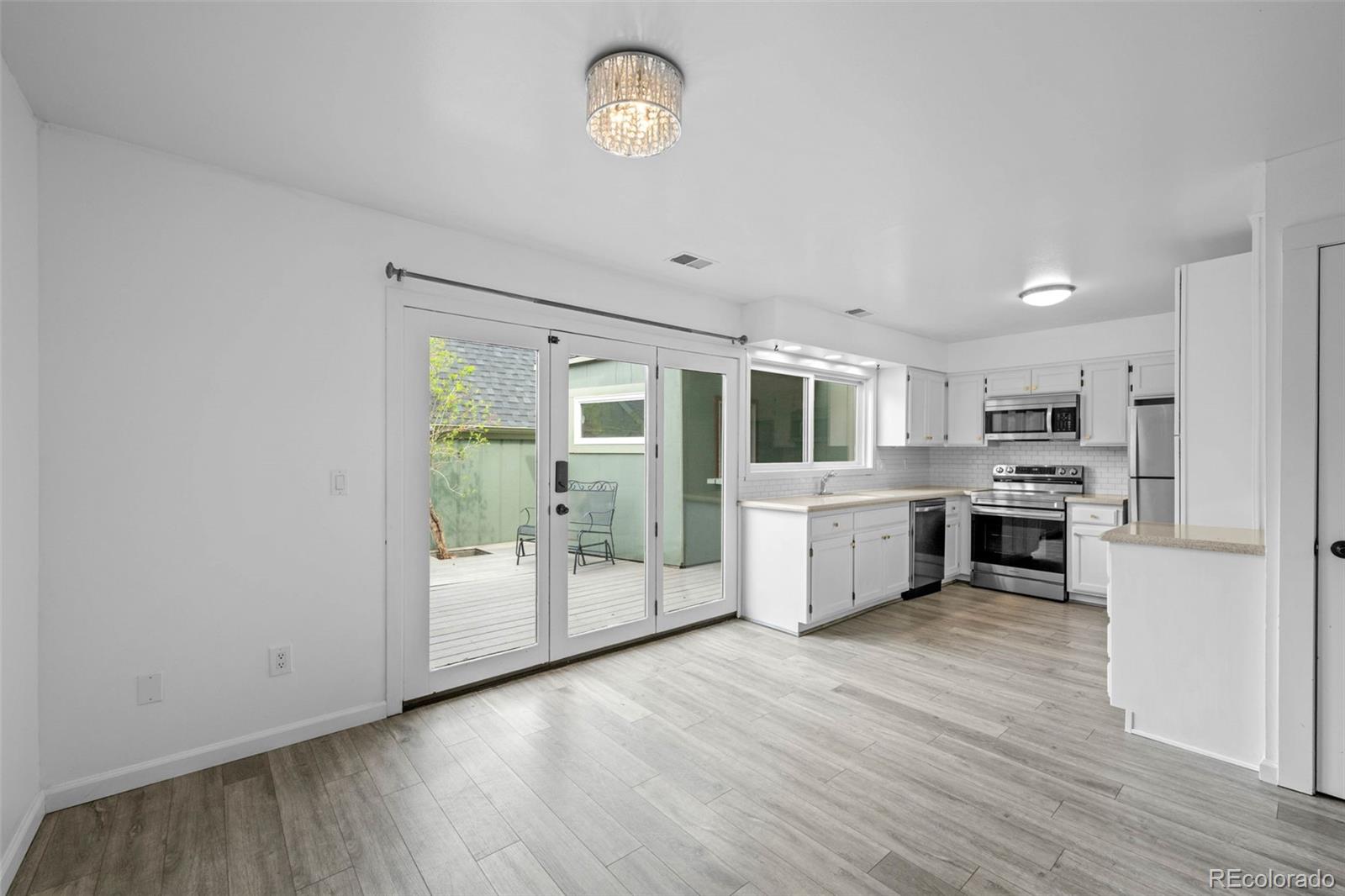 34 Benthaven Place Boulder, CO 80305 - Photo 16 of 40 a large kitchen with a large counter top stainless steel appliances and cabinets