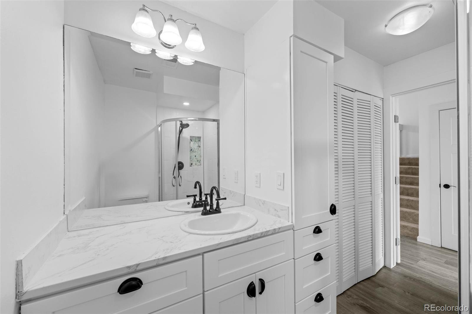 34 Benthaven Place Boulder, CO 80305 - Photo 21 of 40 a bathroom with a sink vanity and a mirror