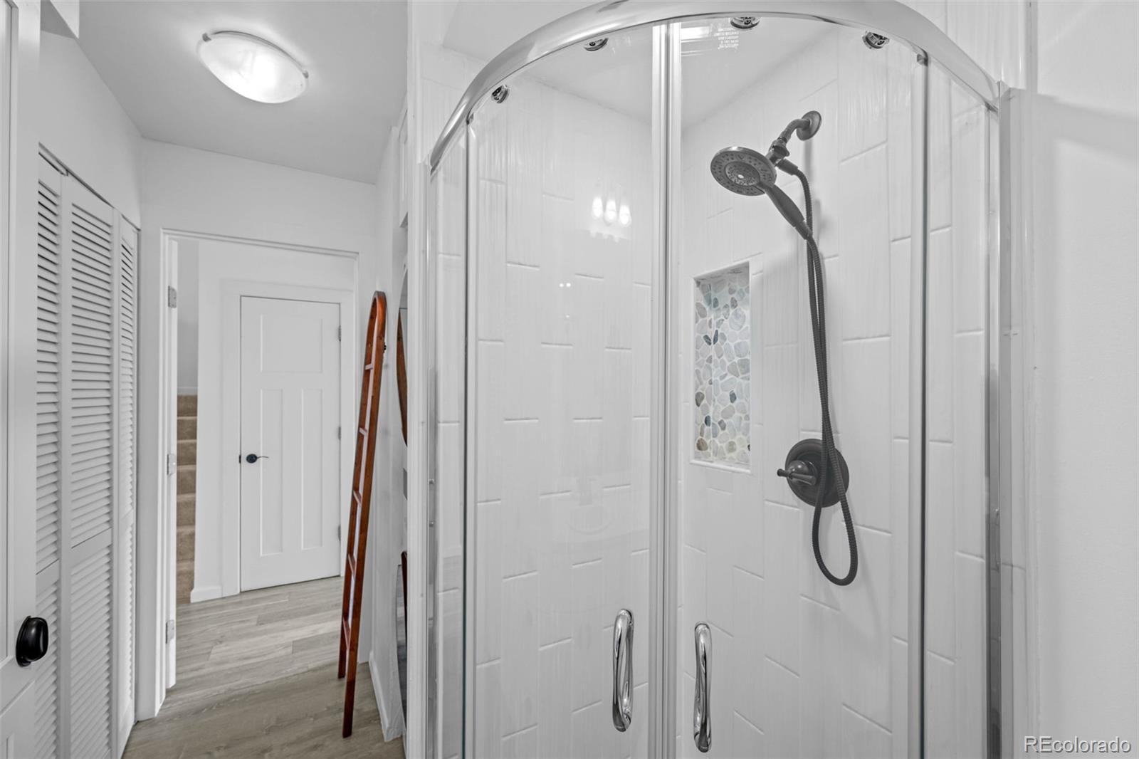 34 Benthaven Place Boulder, CO 80305 - Photo 22 of 40 a bathroom with a glass shower door and a shower