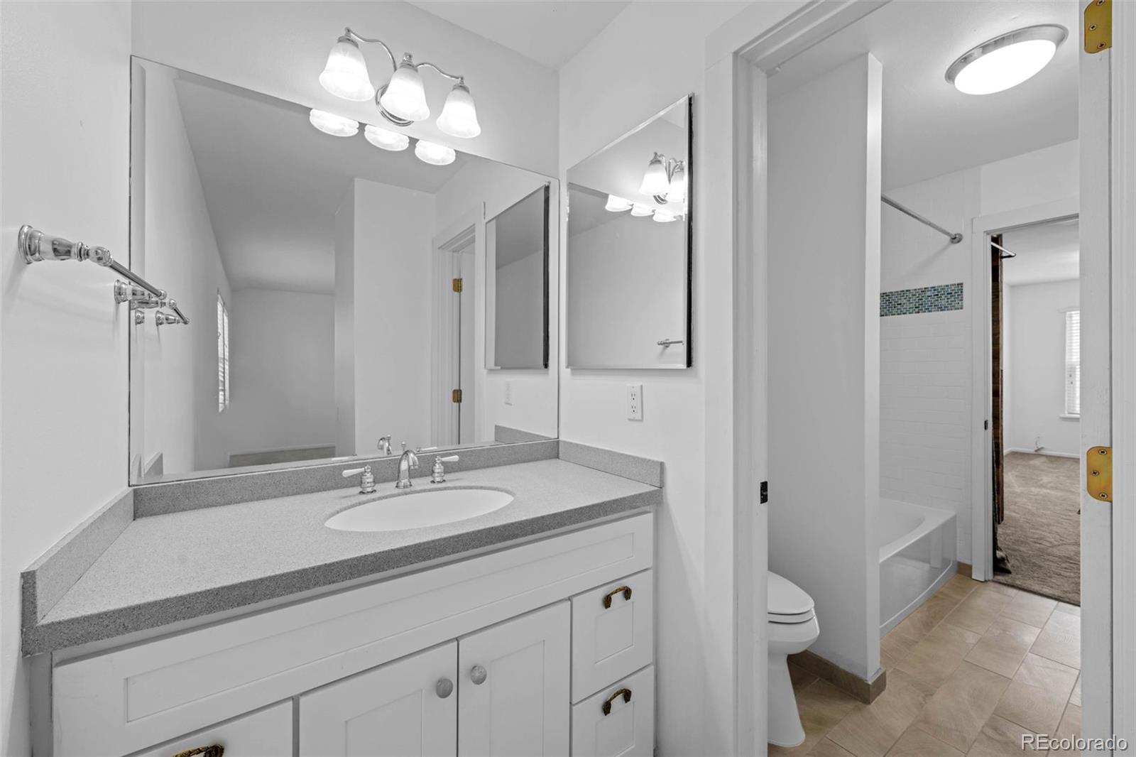 34 Benthaven Place Boulder, CO 80305 - Photo 26 of 40 a bathroom with a sink a toilet and a large mirror